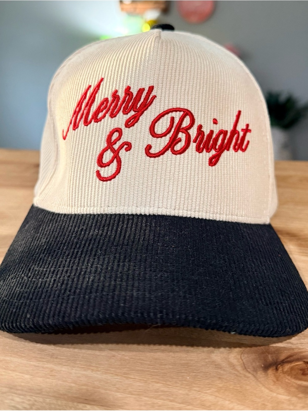 C.C Merry & Bright Two-Tone Corduroy Cap in Cream and Black with Red Embroidery